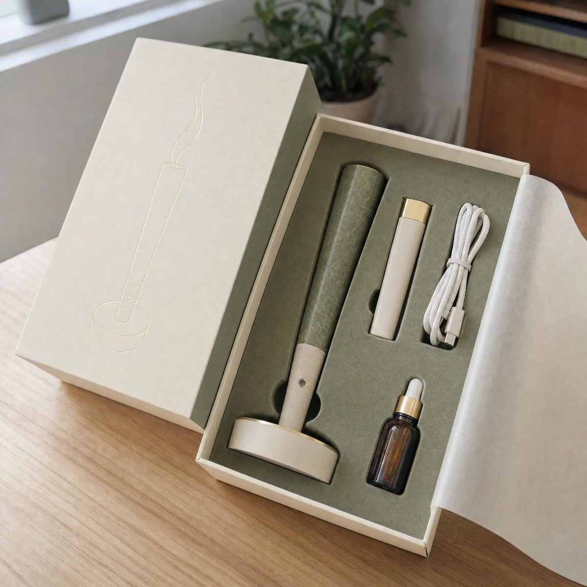 Hotbox Mist gift box opened showing diffuser, lighter-style remote, cable and dropper bottle